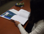 A person studying papers at a desk.